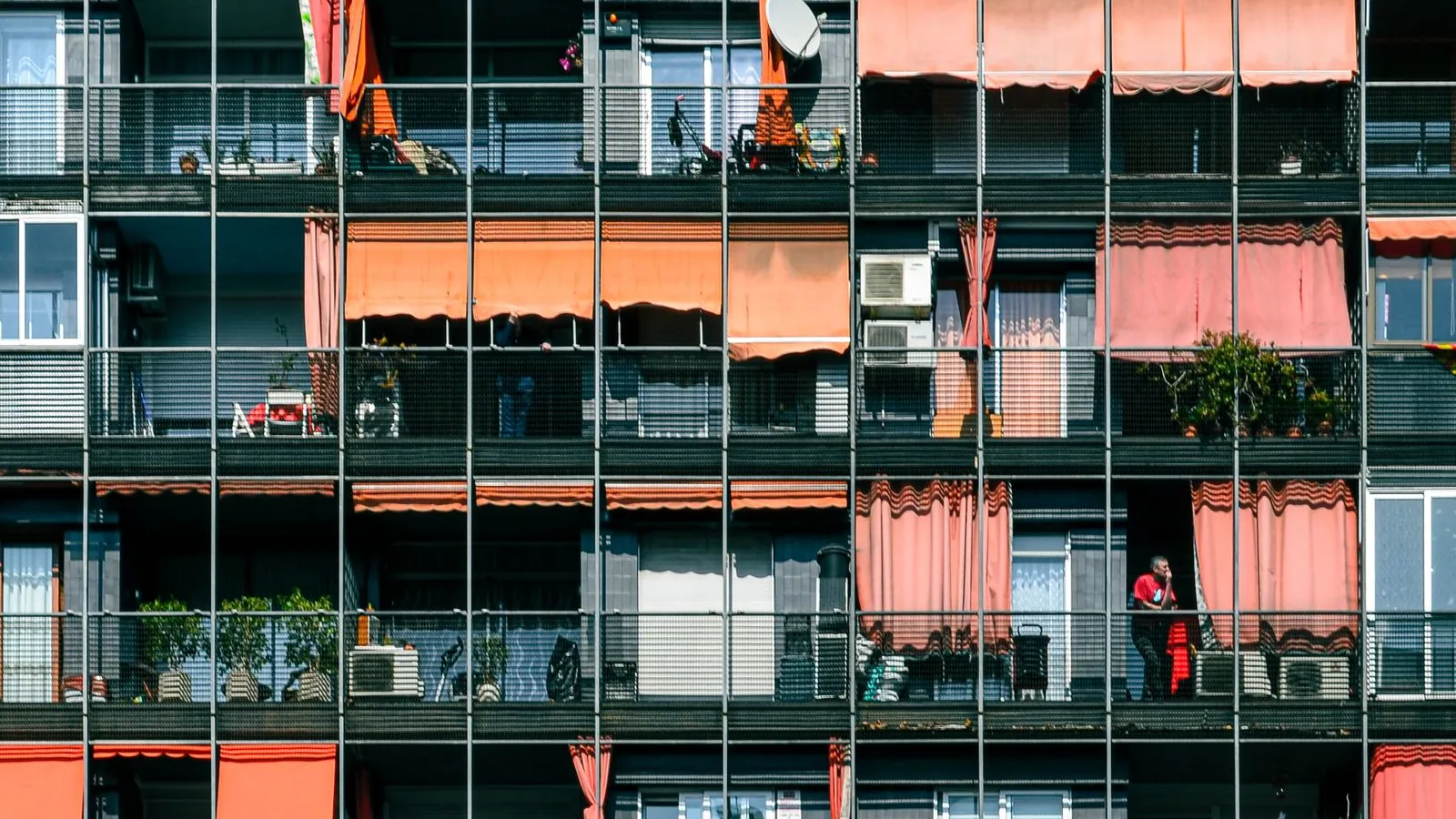 Facade of an apartment block with coloured balconies