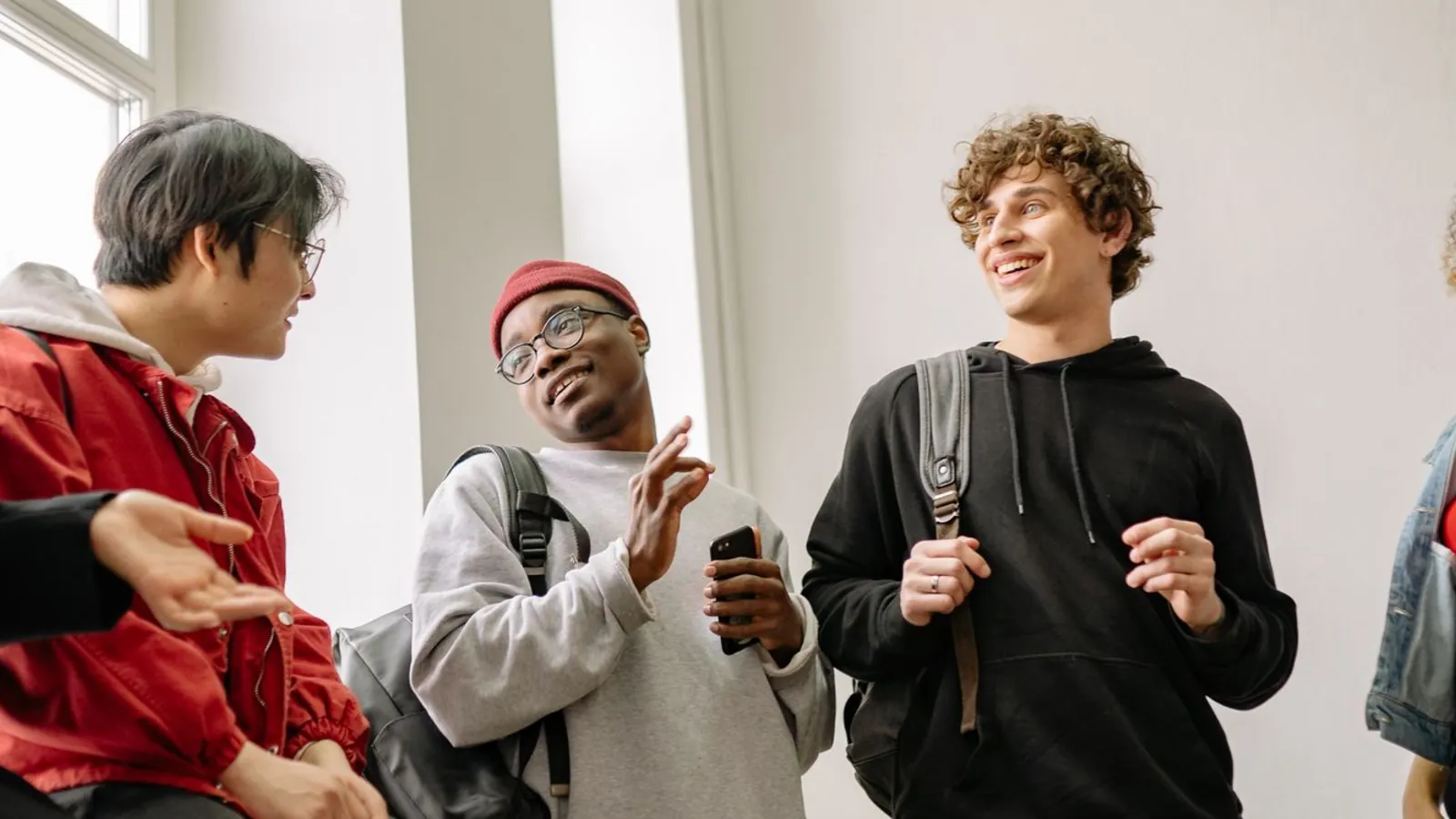 Three friends talking and laughing