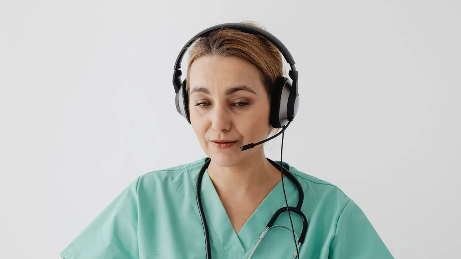 A doctor taking a consultation over a headset
