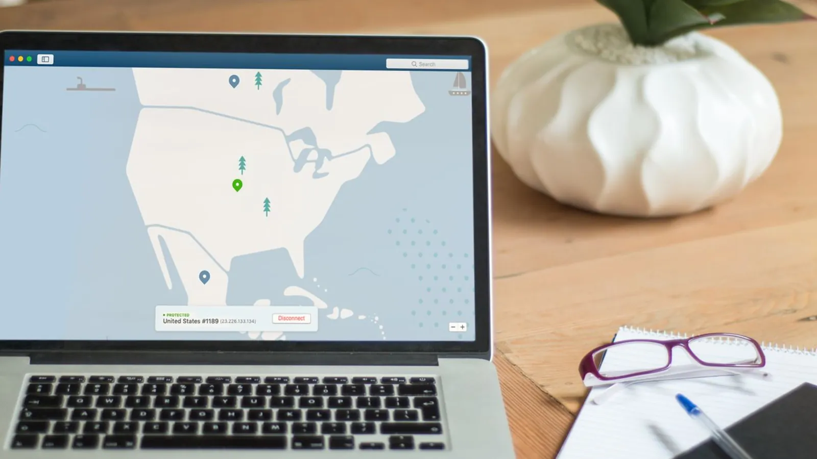 A laptop showing a VPN server map